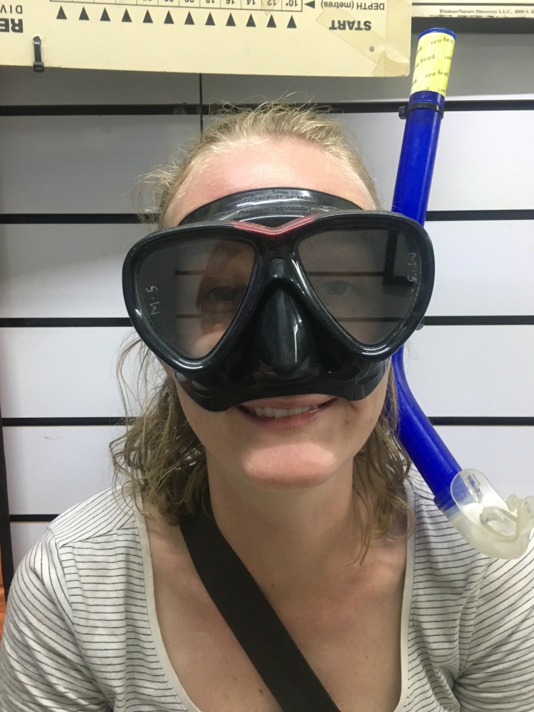 Woman wearing diving goggles and a snorkel